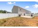 A backyard with patio, grill, and partial fencing at 2011 Valdosta Way, Charlotte, NC 28215