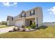 Charming two-story home with a two-car garage and beautifully landscaped front yard at 2011 Valdosta Way, Charlotte, NC 28215