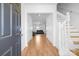 Entryway with hardwood floors, staircase and an open view into the living area at 2011 Valdosta Way, Charlotte, NC 28215