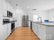 Bright kitchen with stainless steel appliances, granite countertops, and ample cabinet space at 2011 Valdosta Way, Charlotte, NC 28215