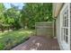 The backyard features a wood deck, green grass, and a wooden fence at 202 Glenn Ave, Kannapolis, NC 28081