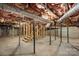 An unfinished basement features support beams, stairs, and cement flooring at 202 Glenn Ave, Kannapolis, NC 28081