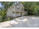 View of the home, and long driveway leading to the residence, surrounded by lush greenery at 202 Glenn Ave, Kannapolis, NC 28081