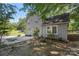 View of the home's side exterior, featuring the yard, driveway, and landscaping at 202 Glenn Ave, Kannapolis, NC 28081