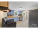 Charming kitchen features blue cabinets, stainless steel appliances, and wood countertops at 202 Glenn Ave, Kannapolis, NC 28081