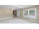 Living room with natural light and ample space; doorway leads to another room at 202 Glenn Ave, Kannapolis, NC 28081