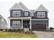 Beautiful two-story home featuring a two-car garage, covered entry, and attractive landscaping at 236 Paradise Dr, Belmont, NC 28012
