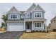 Attractive two-story home with a one-car garage and inviting front entrance at 236 Paradise Dr, Belmont, NC 28012
