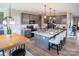 Modern kitchen featuring a large center island, breakfast bar, and stylish gray cabinetry at 236 Paradise Dr, Belmont, NC 28012