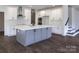 Spacious kitchen featuring a large island, white cabinetry, and stainless steel appliances at 236 Paradise Dr, Belmont, NC 28012