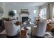 Inviting living room with ample seating, a cozy fireplace, and plenty of natural light at 236 Paradise Dr, Belmont, NC 28012