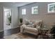 Cozy sitting room area with a comfortable couch and soft lighting at 236 Paradise Dr, Belmont, NC 28012