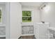 Freshly painted half bathroom with brick accents and modern vanity at 240 Swink Ave, Salisbury, NC 28147
