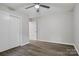 This bedroom has luxury vinyl plank flooring, a ceiling fan, and a double-door closet at 240 Swink Ave, Salisbury, NC 28147