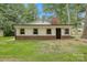 Charming home exterior with white siding, brick foundation, and a red brick chimney at 240 Swink Ave, Salisbury, NC 28147
