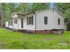 Exterior view of home with white siding and brick foundation at 240 Swink Ave, Salisbury, NC 28147