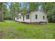 Exterior view of home with white siding, brick foundation, and well-manicured lawn at 240 Swink Ave, Salisbury, NC 28147