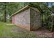 Side view of detached garage set on a grassy lot at 240 Swink Ave, Salisbury, NC 28147
