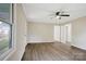 Bright living room featuring ceiling fan, hard surface floors, neutral paint, and white trim at 240 Swink Ave, Salisbury, NC 28147