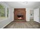 Bright living room with fireplace and two windows at 240 Swink Ave, Salisbury, NC 28147
