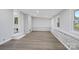 Spacious living room with brick accent walls and modern, neutral-toned paint at 240 Swink Ave, Salisbury, NC 28147