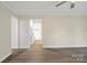 Spacious living room featuring hard surface floors, neutral paint, and white trim at 240 Swink Ave, Salisbury, NC 28147