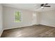 Bright living room with hard surface floors, neutral paint, and a ceiling fan at 240 Swink Ave, Salisbury, NC 28147