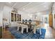 Dining room featuring a display cabinet, and an open concept design to the living room at 2501 Christenbury Hall Nw Ct, Concord, NC 28027
