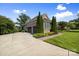Charming home exterior with stone accents, manicured landscaping, a driveway, and two-car garage at 2501 Christenbury Hall Nw Ct, Concord, NC 28027