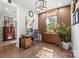 Bright home office with natural light, hardwood floors, modern desk and storage, and stylish decorative accents at 2501 Christenbury Hall Nw Ct, Concord, NC 28027