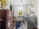 Functional laundry room with modern appliances, ample storage, and natural light at 2501 Christenbury Hall Nw Ct, Concord, NC 28027