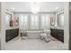 Bright main bathroom with a soaking tub, double vanities, and elegant fixtures at 2501 Christenbury Hall Nw Ct, Concord, NC 28027