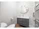 Modern powder room with a stylish vanity, decorative mirror, and elegant finishes at 2501 Christenbury Hall Nw Ct, Concord, NC 28027
