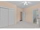 Bedroom with carpet, closet with sliding doors, and access to a bathroom at 2504 Fallbrook Pl, Concord, NC 28027