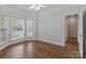 Bedroom with hardwood floors and a bay window. Large windows provide natural light at 2504 Fallbrook Pl, Concord, NC 28027