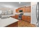 Well-equipped kitchen featuring a modern range, ample cabinetry, and stainless steel sink at 2504 Fallbrook Pl, Concord, NC 28027