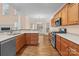 Spacious kitchen featuring stainless appliances, ample counter space, and cabinetry adjacent to dining area at 2504 Fallbrook Pl, Concord, NC 28027