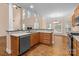 Well-equipped kitchen featuring ample cabinet space and modern appliances adjacent to an eat-in dining area at 2504 Fallbrook Pl, Concord, NC 28027