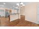 Modern kitchen open to living area, featuring stainless steel appliances and center island with bar seating at 2504 Fallbrook Pl, Concord, NC 28027