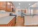 Spacious kitchen featuring stainless steel appliances, granite countertops, and hardwood floors throughout at 2504 Fallbrook Pl, Concord, NC 28027