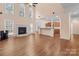 Expansive living room with a fireplace, hardwood floors, and an open layout perfect for entertaining at 2504 Fallbrook Pl, Concord, NC 28027