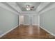 Spacious main bedroom with trey ceilings, neutral walls, and hardwood floors at 2504 Fallbrook Pl, Concord, NC 28027