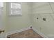 Small walk-in closet featuring wire shelves and a small window for natural light at 2504 Fallbrook Pl, Concord, NC 28027
