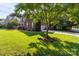 A green front yard with a brick home in the background at 2504 Fallbrook Pl, Concord, NC 28027