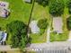 An aerial view of the home shows the layout of the house, driveway, street, and surrounding green lawn and mature trees at 2519 2Nd Sw Ave, Hickory, NC 28602
