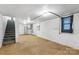 Unfinished basement with concrete floor and stairs leading up at 2519 2Nd Sw Ave, Hickory, NC 28602