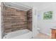 Bathroom features wood-look tile, bathtub and tiled showerhead at 2519 2Nd Sw Ave, Hickory, NC 28602