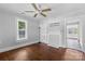 Inviting bedroom featuring hardwood flooring, a classic ceiling fan, and ample natural light at 2519 2Nd Sw Ave, Hickory, NC 28602