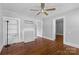 Cozy bedroom showcasing original hardwood floors, traditional trim, and neutral paint at 2519 2Nd Sw Ave, Hickory, NC 28602