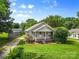 Lovely home showcasing a neat lawn, shrubs, and trees, complete with a inviting walkway and covered entry at 2519 2Nd Sw Ave, Hickory, NC 28602